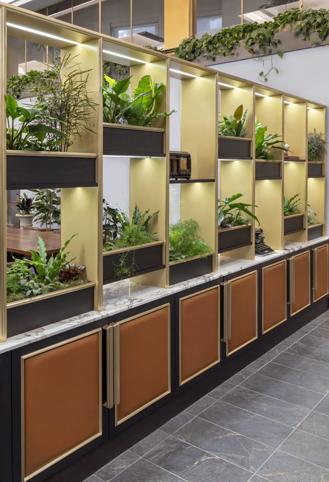 Detail shot of the biophilic installation showing plant variety and architectural framing
